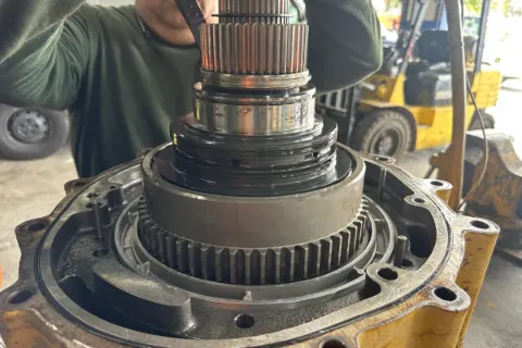 Heavy-equipment undercarriage components being serviced — photo 2