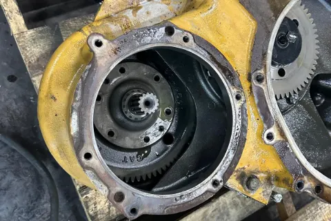 Heavy-equipment undercarriage components being serviced — photo 3